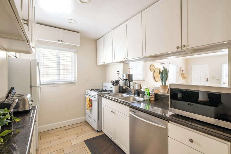 Sit up at the serve through breakfast bar and keep the chef company 