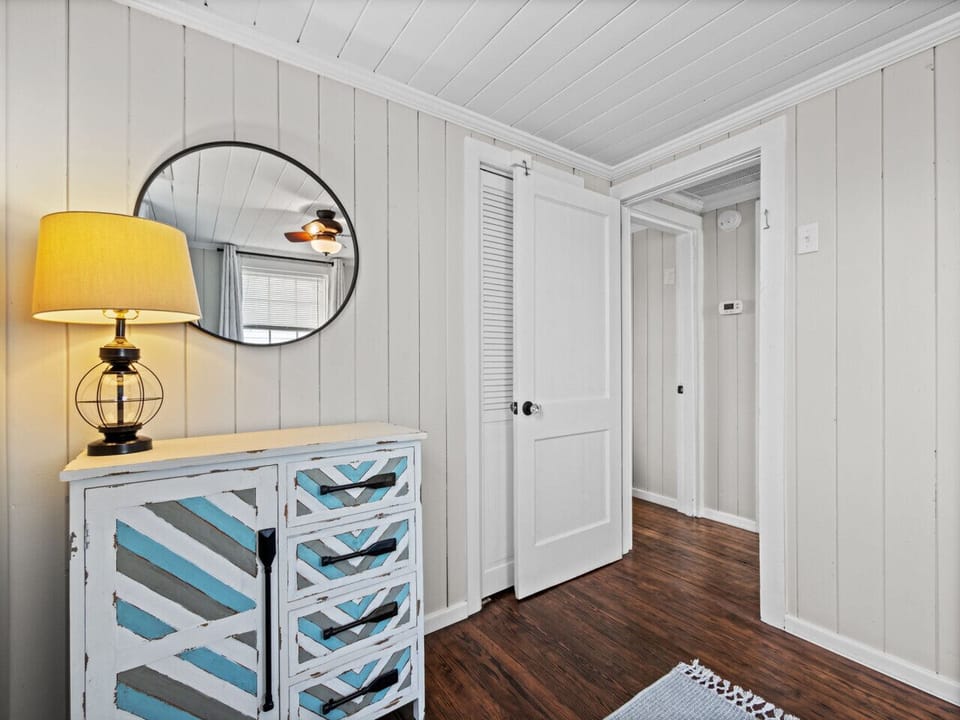 Airy and cheerful, this second bedroom offers extra sleeping room and a soft, welcoming vibe that fits every kind of guest.