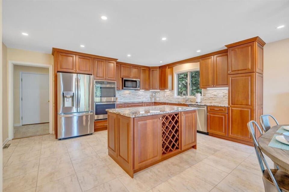 Fully-equipped kitchen with granite countertops and stainless steel appliances