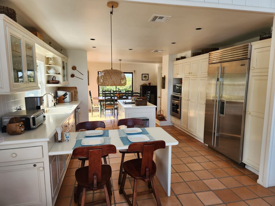 Open kitchen with built-in eating area