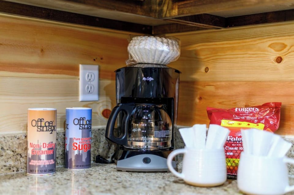Coffee lovers welcome: enjoy fresh brews with the provided coffee maker, mugs, and a starter set of creamer and sugar.