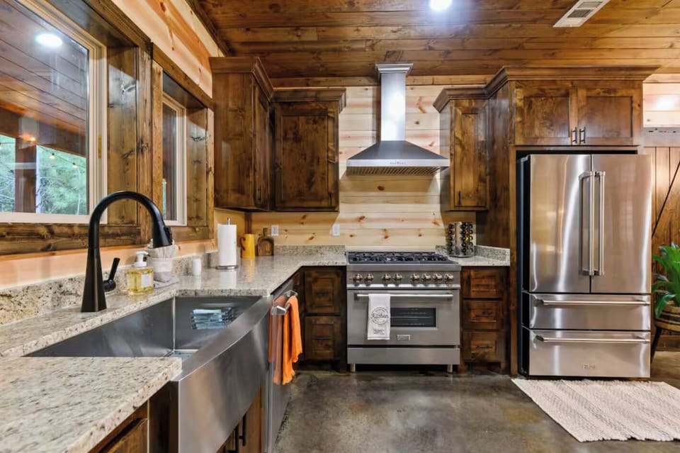 Fully equipped for any meal—this kitchen includes a refrigerator, dishwasher, microwave, and even pantry spices.
