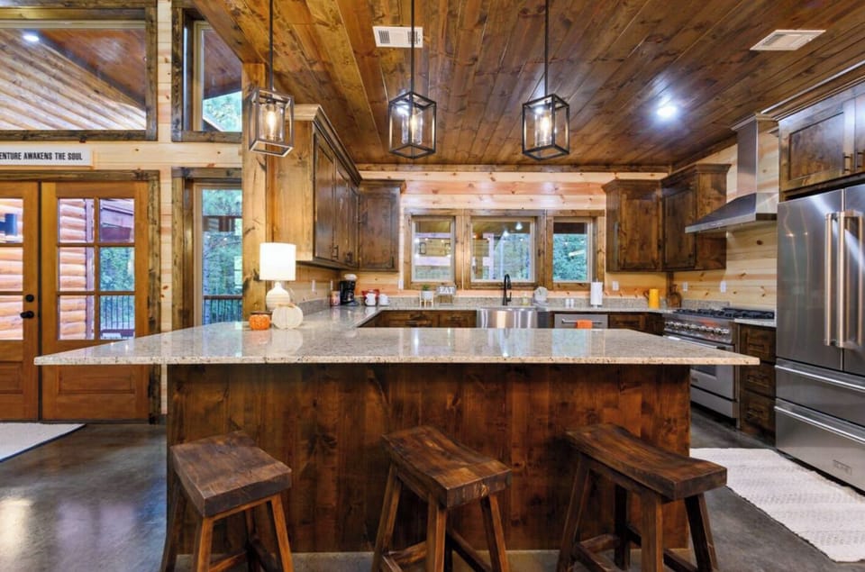 Features like a kitchen island, coffee setup, and complete dishware make this kitchen both stylish and practical