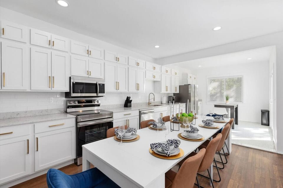 Modern kitchen with dining table seating for 10.