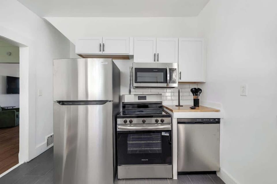 Fully equipped kitchen with stainless steel appliances.