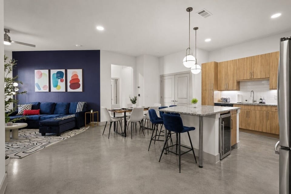 Living Room & Dining Area: Bold decor and modern furnishings create a lively atmosphere for gatherings!