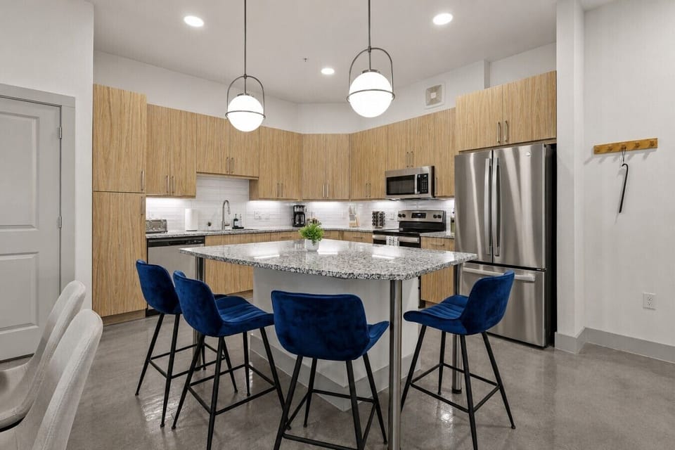Kitchen: Modern elegance with sleek finishes and vibrant seating for memorable meals and gatherings!
