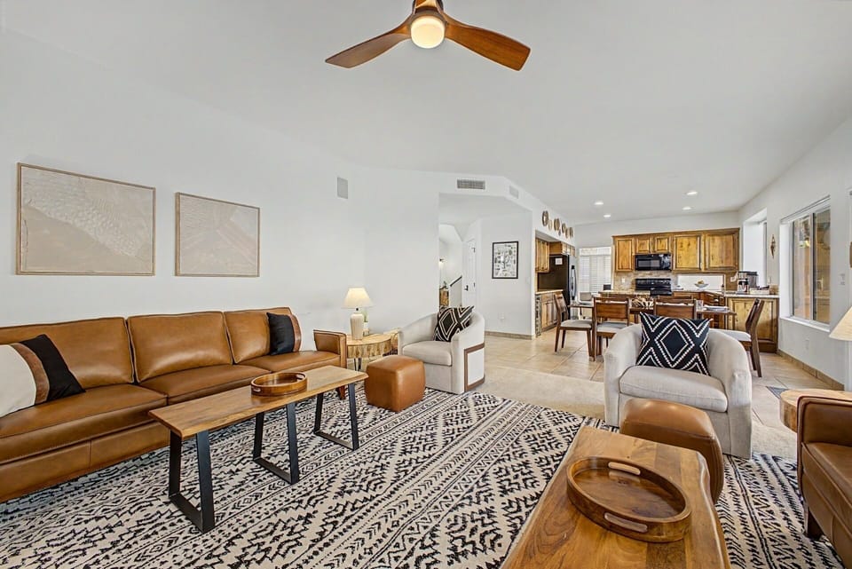Living Room: Bright and airy space with modern decor, comfy seating, and an inviting atmosphere! open concept kitchen and dining table.