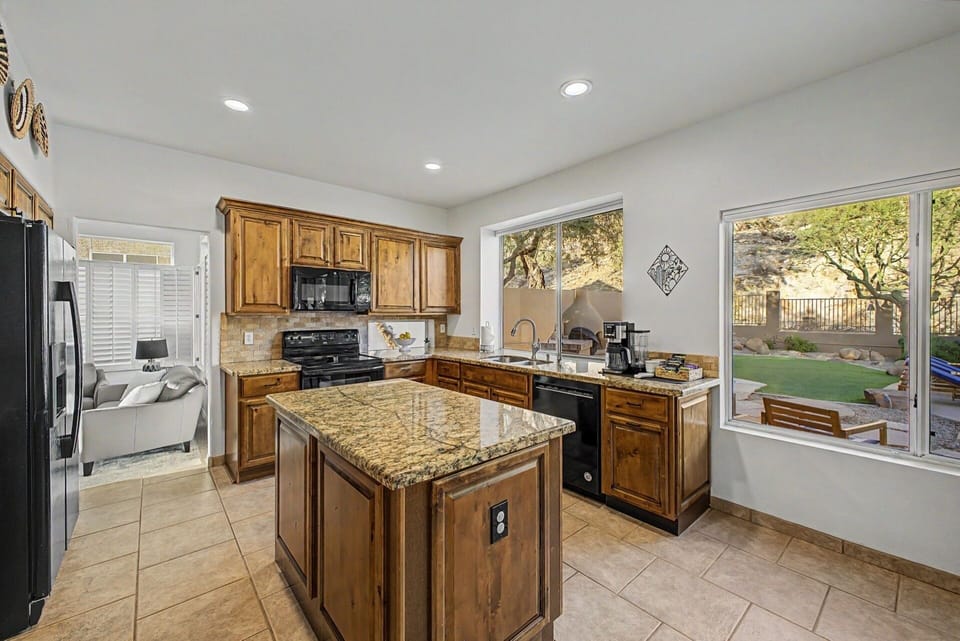 Open and bright kitchen with mountain view.