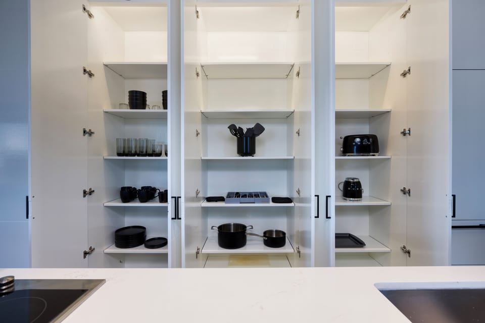 three well-organized cabinets designed to store all your kitchen essentials.