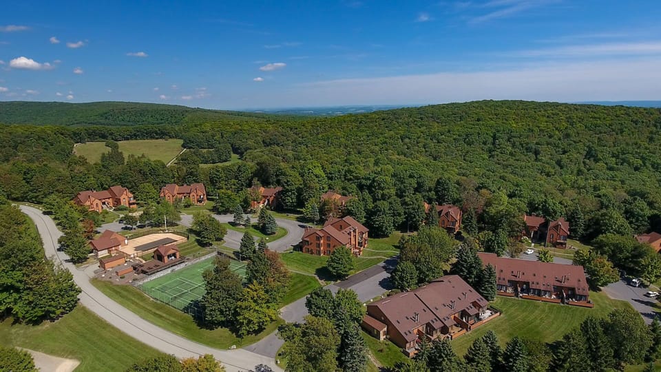 Aerial view of Swiss Mountain tucked into the forested slopes of the Laurel Highlands.