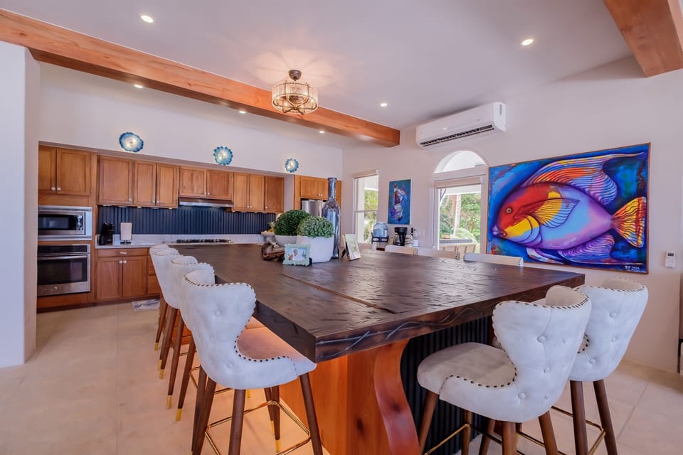 Oceanview Kitchen has a huge island that seats 8.  Opens to dining area and living room