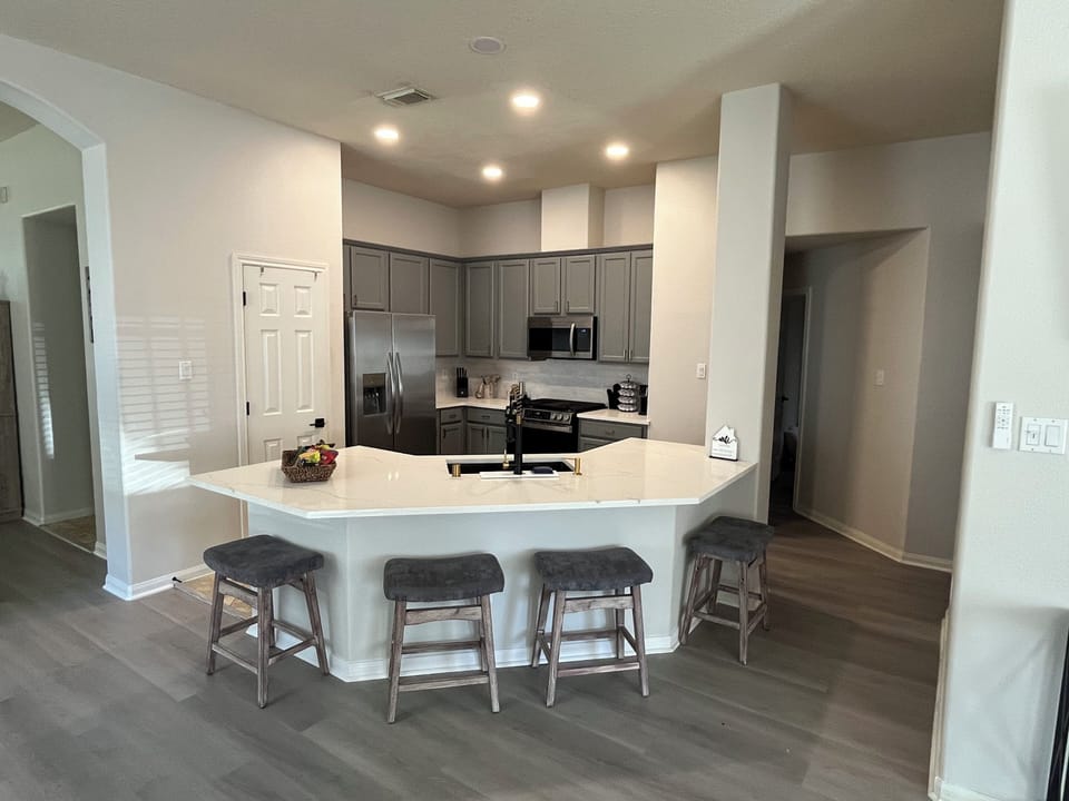 Spacious kitchen with new appliances and gas range 5 burner stove