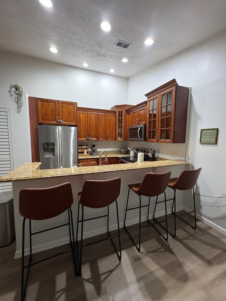 Cook inspiring meals in the fully equipped kitchen, featuring modern appliances and generous counter space.