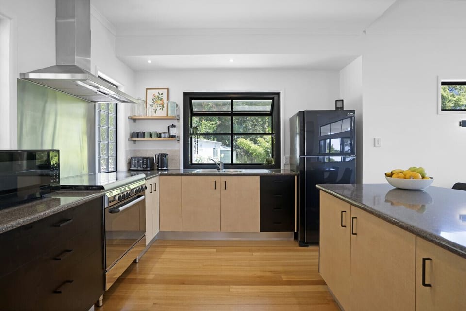 Fully equipped kitchen with gas stove and kitchen island