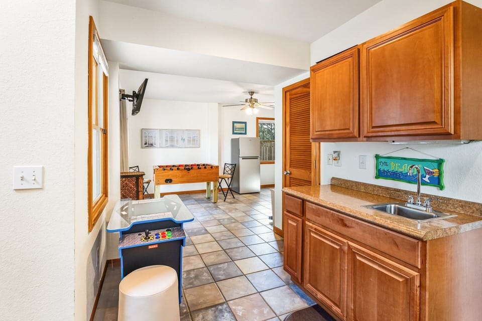 Challenge friends to foosball or arcade games in the ground-level rec room with a wet bar and flat-screen TV.