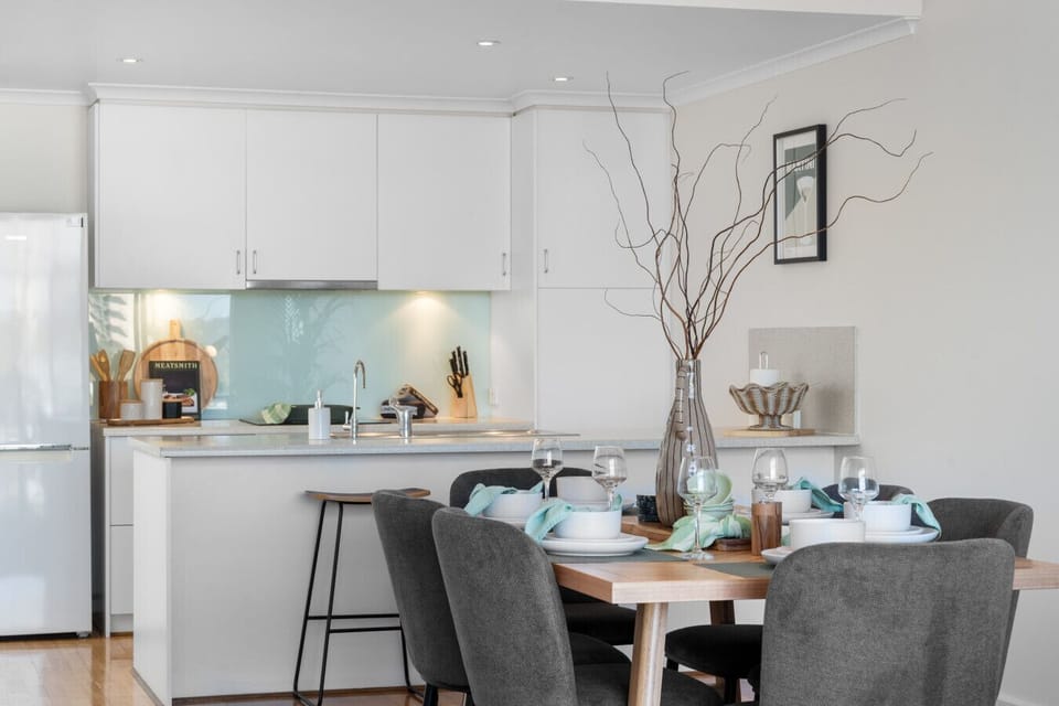 Share meals and moments in the open-plan kitchen and dining area designed for connection.