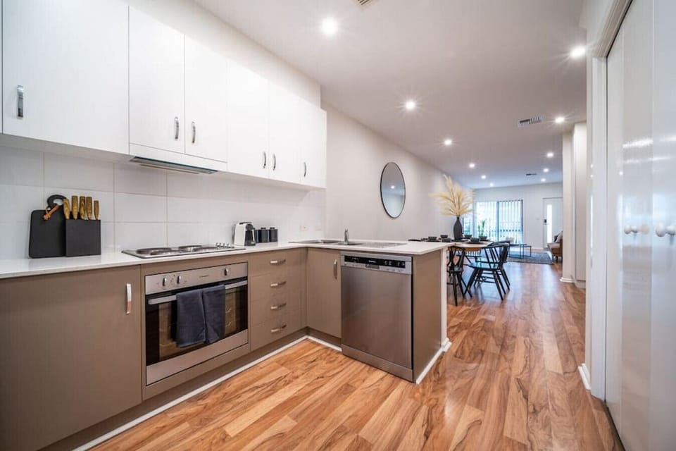 Cook with ease in the modern kitchen, thoughtfully equipped with quality appliances, generous bench space, and everything needed for relaxed meals during your stay.