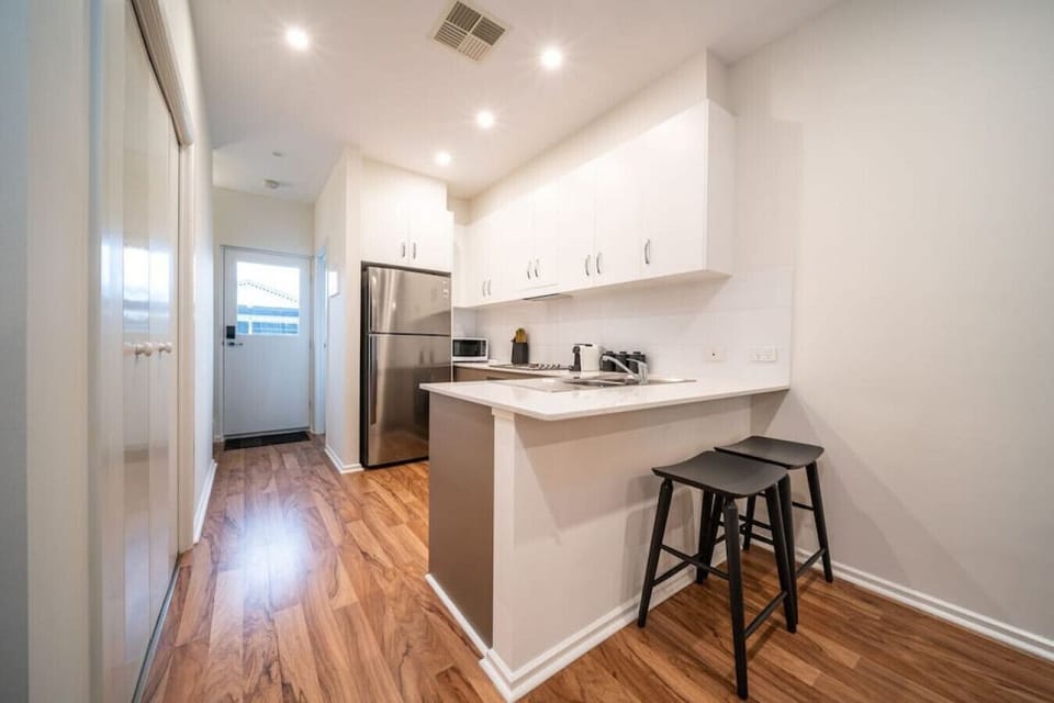 Pull up a stool at the breakfast bar for a casual coffee, quick bite, or easy catch-up while meals are prepared in the bright and functional kitchen.