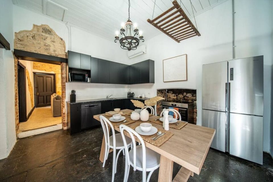 Prepare meals in a well-equipped kitchen that blends modern convenience with country-style finishes.