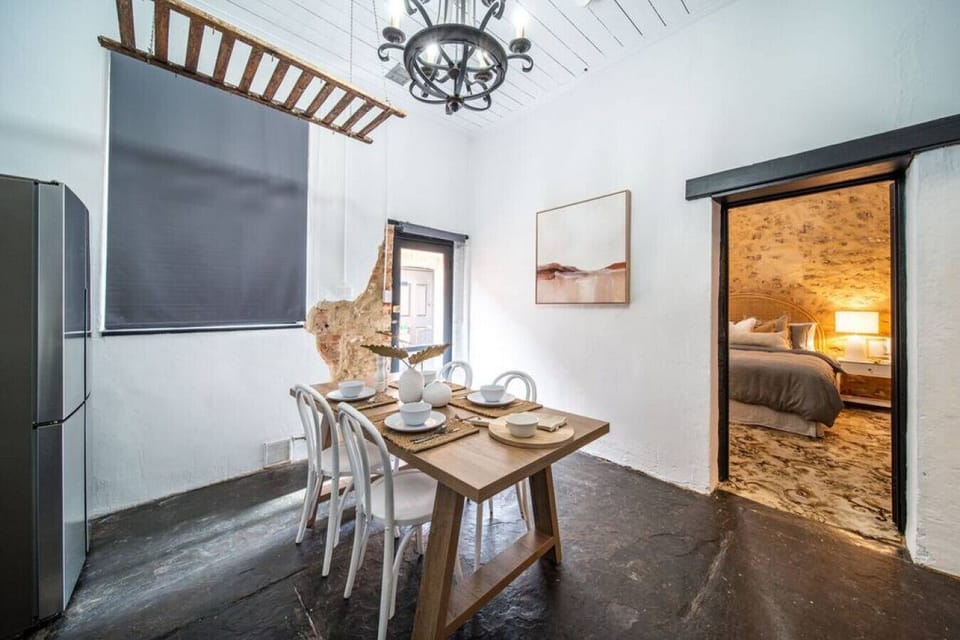 Gather around the dining table for four, ideal for slow meals and shared moments.