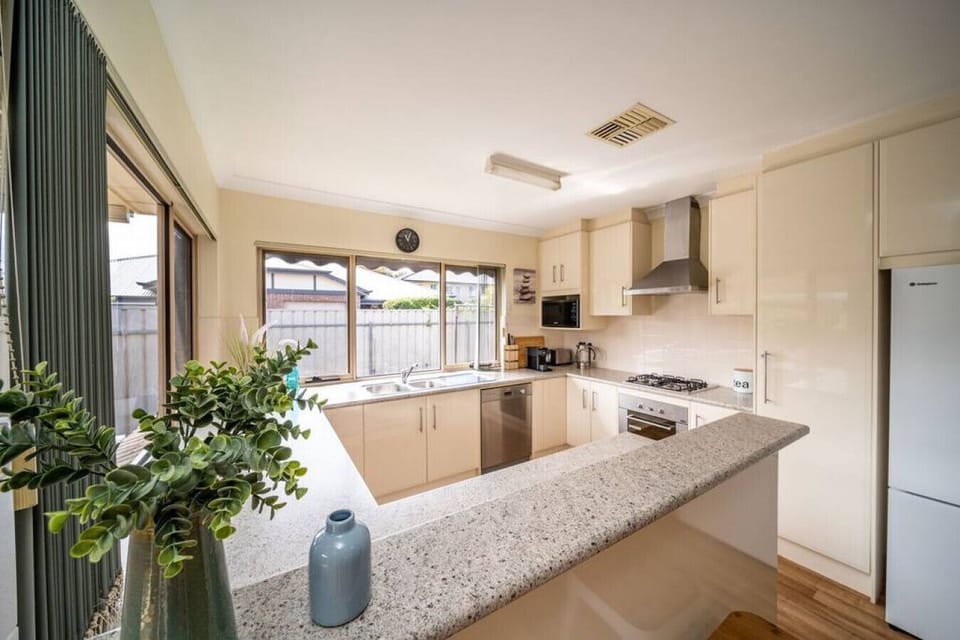 Prepare meals with ease in the fully equipped kitchen, complete with everything needed for a comfortable stay.