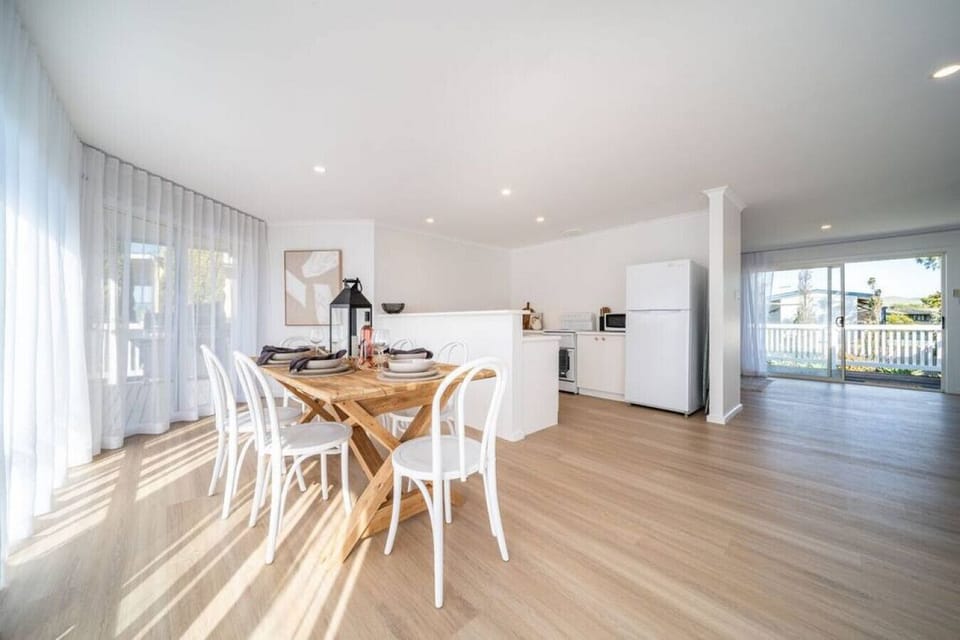 A well-appointed dining area seamlessly connects to the kitchen, offering the perfect setup for meals.