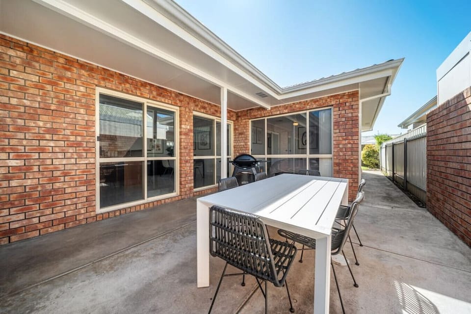 Enjoy outdoor dining in the private courtyard, an inviting space for relaxed meals and evening barbecues.