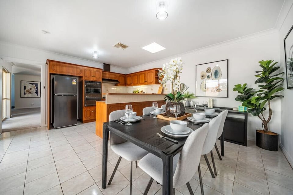 The kitchen and dinning area form a central hub for meals, game nights and lively conversation.