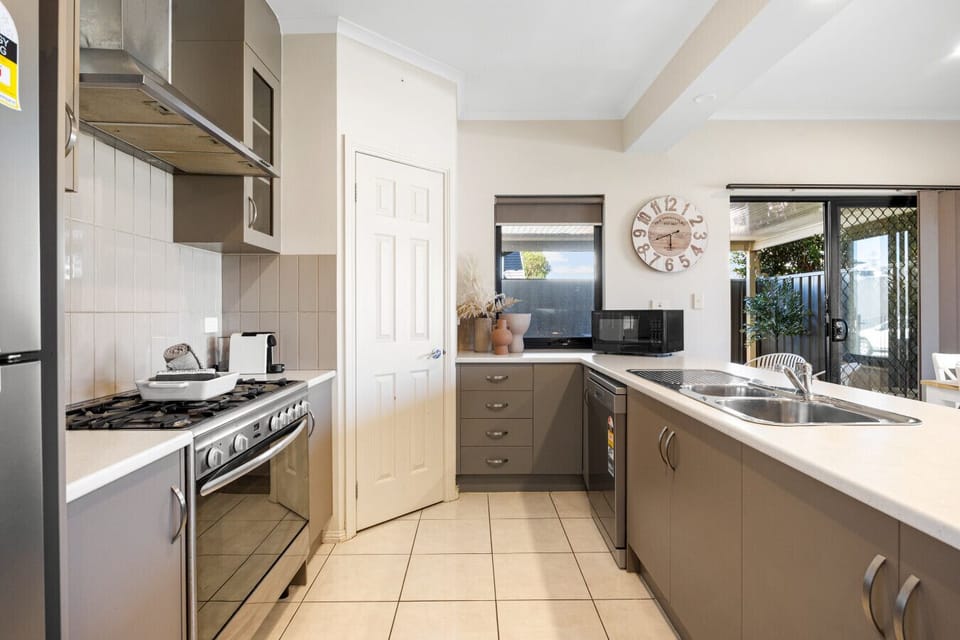 Prepare meals with ease in the well-equipped kitchen, where everything is set for a comfortable stay.