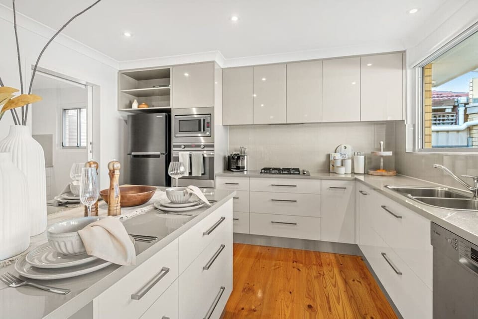 Cook with ease in the bright kitchen where generous bench space and modern appliances make everything from quick breakfasts to relaxed dinners simple.