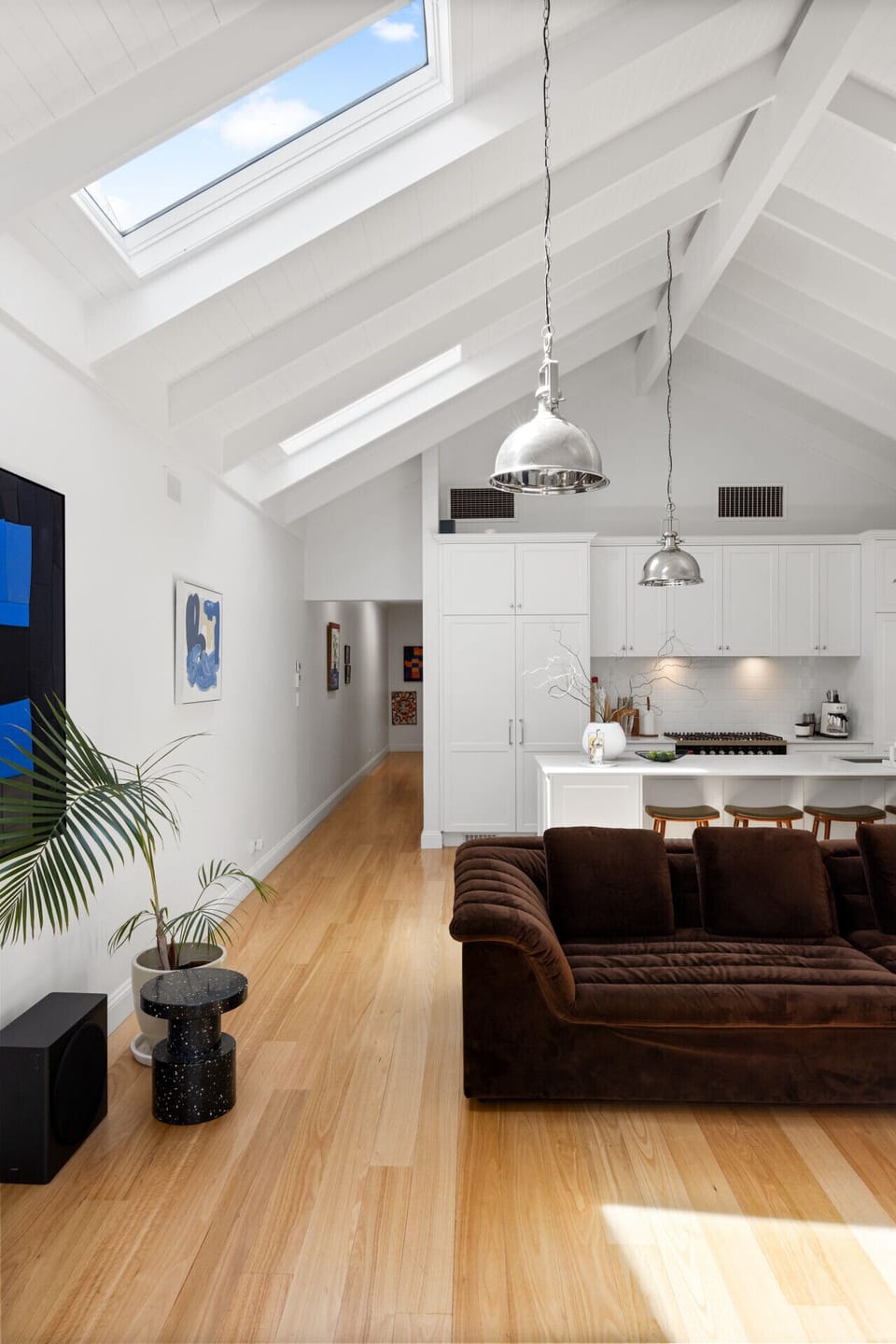 Another view of the main living area reveals its seamless flow to the kitchen, encouraging easy gathering and relaxation.