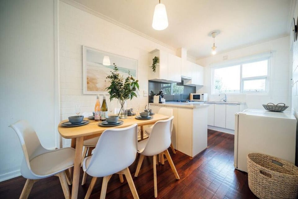 Share meals or morning coffee around the six-seater timber dining table, bathed in natural light and flowing seamlessly into the open-plan living space.