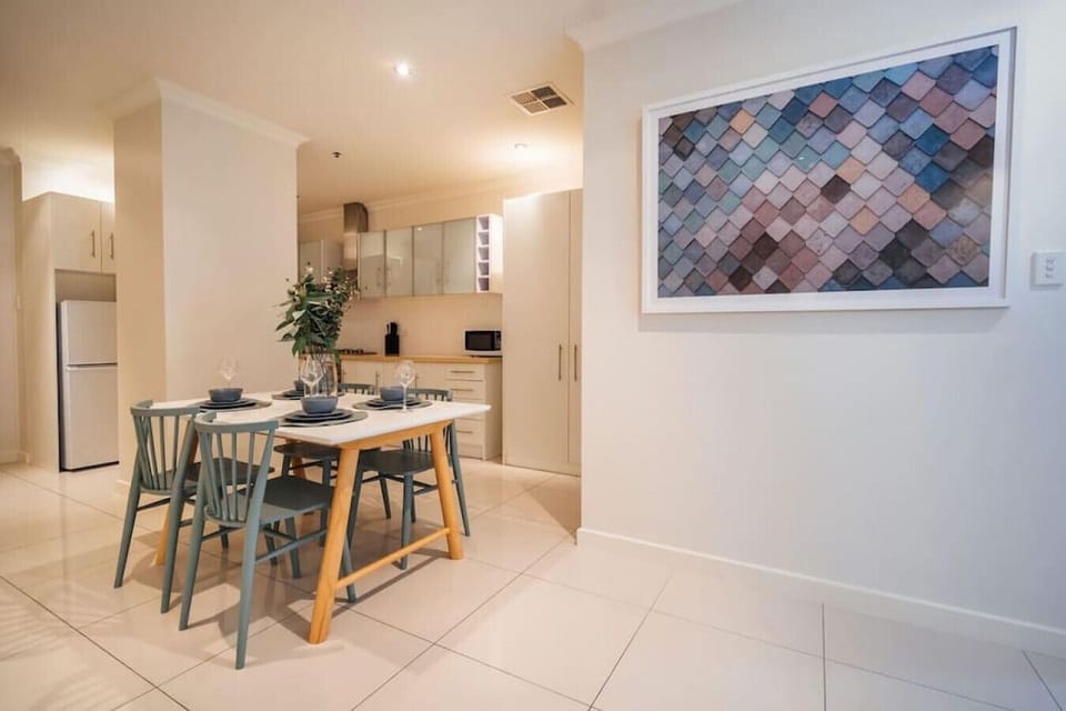Enjoy easy meals in the open-plan kitchen and dining space designed for connection.