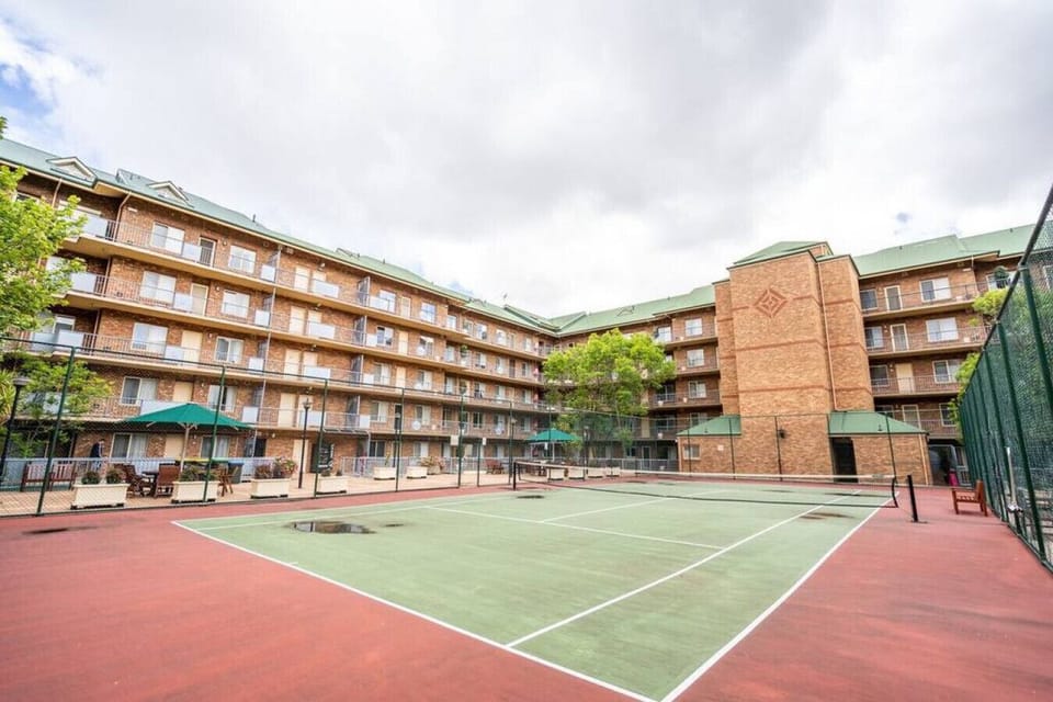 Enjoy access to a full-size shared tennis court, an uncommon find in a CBD apartment, perfect for a casual hit.