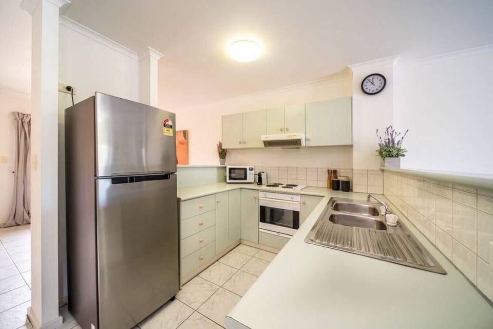 The kitchen is fully equipped with a fridge, oven, cooktop, microwave, dishwasher, Nespresso machine, and all the essentials for simple cooking.