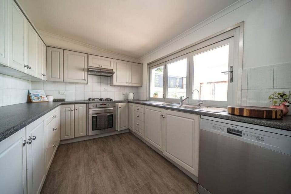 The fully equipped kitchen has everything you need to cook up a feast — or just pour a glass of wine and order in.