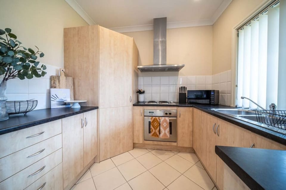 Prepare meals with ease in the bright, functional kitchen, thoughtfully laid out for everyday comfort.