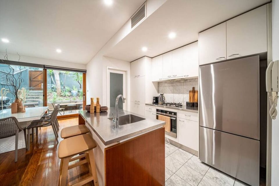 Cook with ease in the bright kitchen, where generous bench space and modern appliances make preparing meals simple.