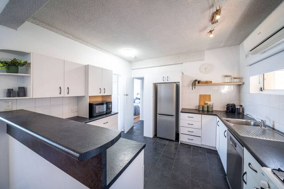 Prepare easy meals in the fully equipped kitchen designed for everyday convenience.