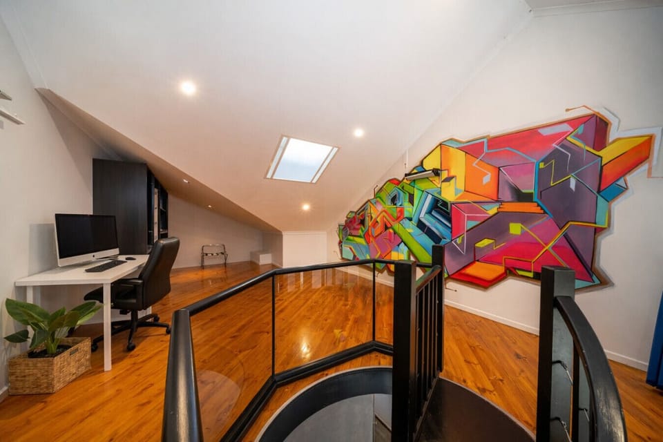 A dedicated workspace offers a comfortable spot to catch up on emails or plan the day.
