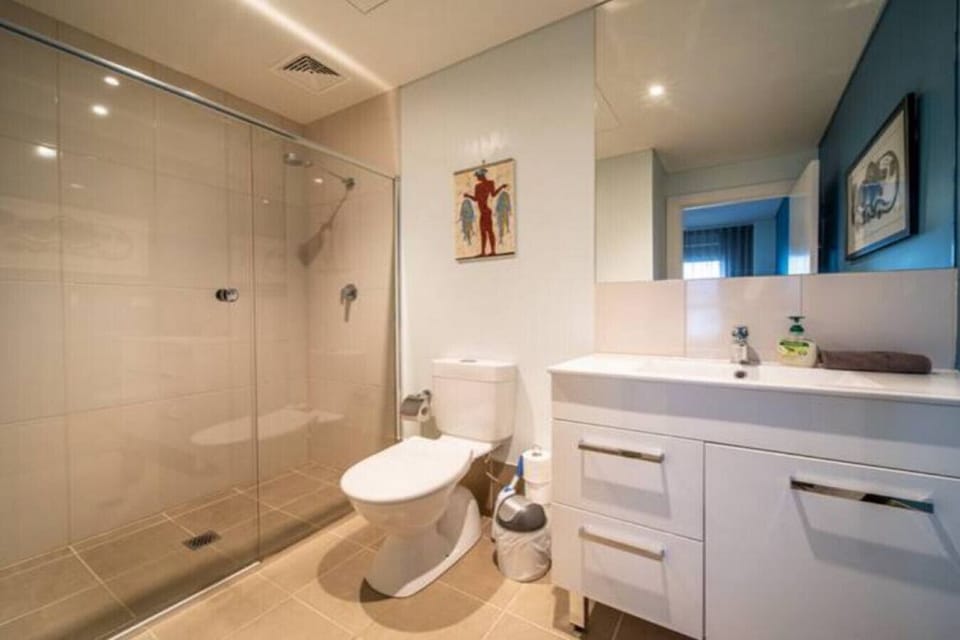 Spacious and practical, the ensuite bathroom features a large walk-in shower and generous vanity space for easy everyday comfort.