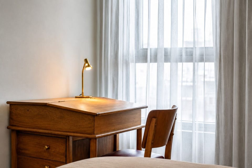 Tucked within the second bedroom, the dedicated workspace offers a quiet spot to catch up on emails, focus on remote work, or plan the day ahead.