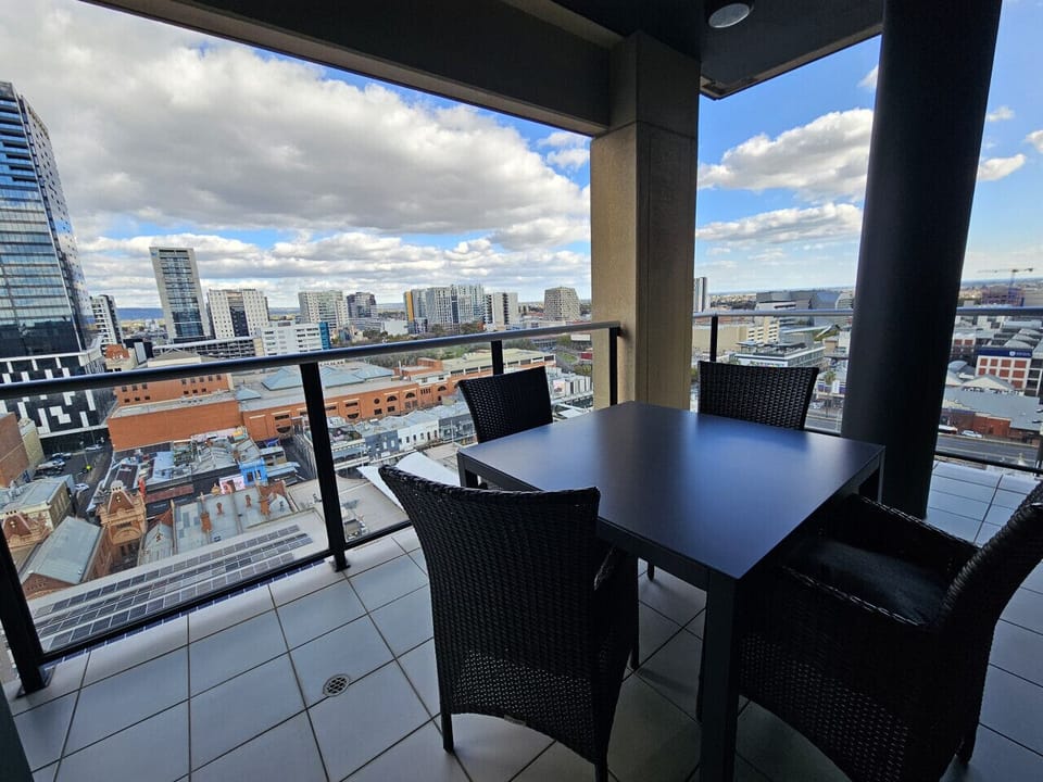 Step out onto your private balcony and take in the city atmosphere with a relaxed outdoor seating area.