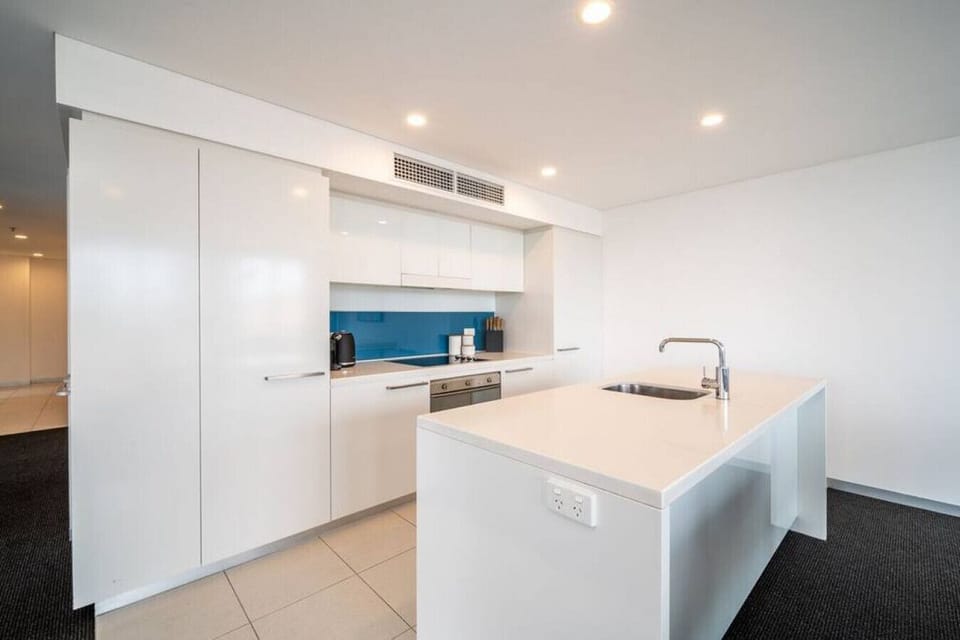 Cook with ease in the modern, fully equipped kitchen featuring quality appliances, generous space, and everything you need for a comfortable stay.
