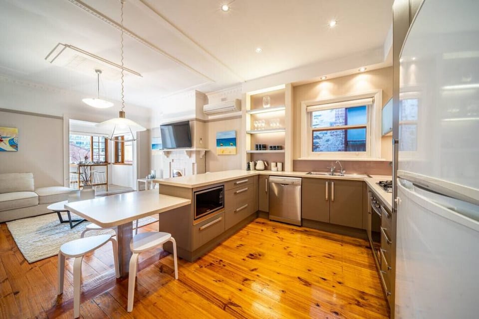 The kitchen offers a practical, uncluttered space to prepare meals at your own pace during your stay.