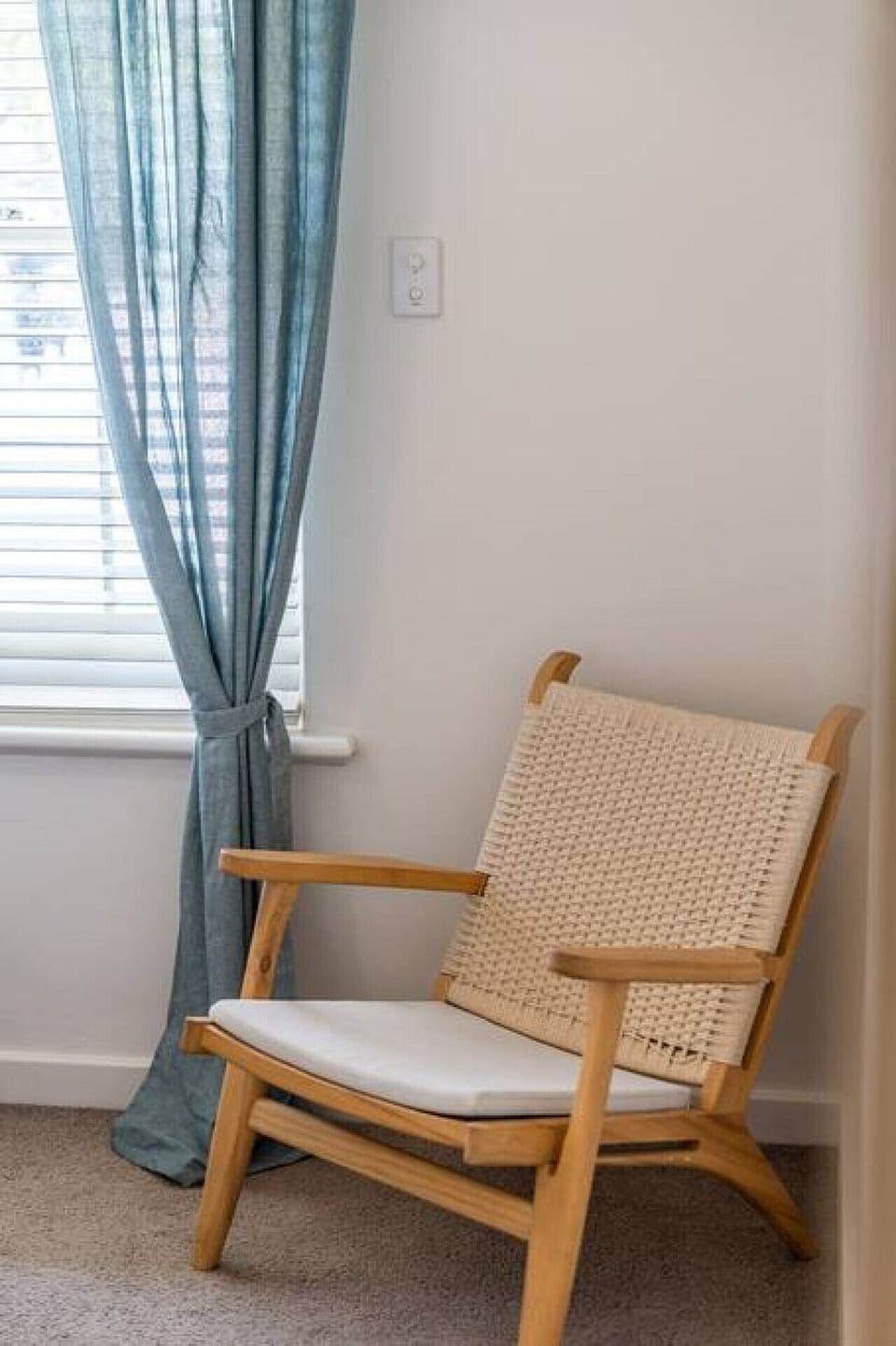 Unwind with a book in the bedroom’s cosy reading corner after a day at the beach.