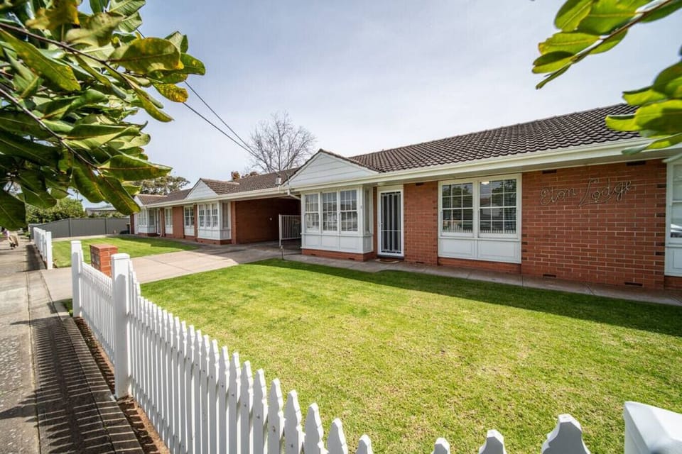 Arrive to a classic single-level home set behind a neat lawn and picket fence in a quiet coastal street.