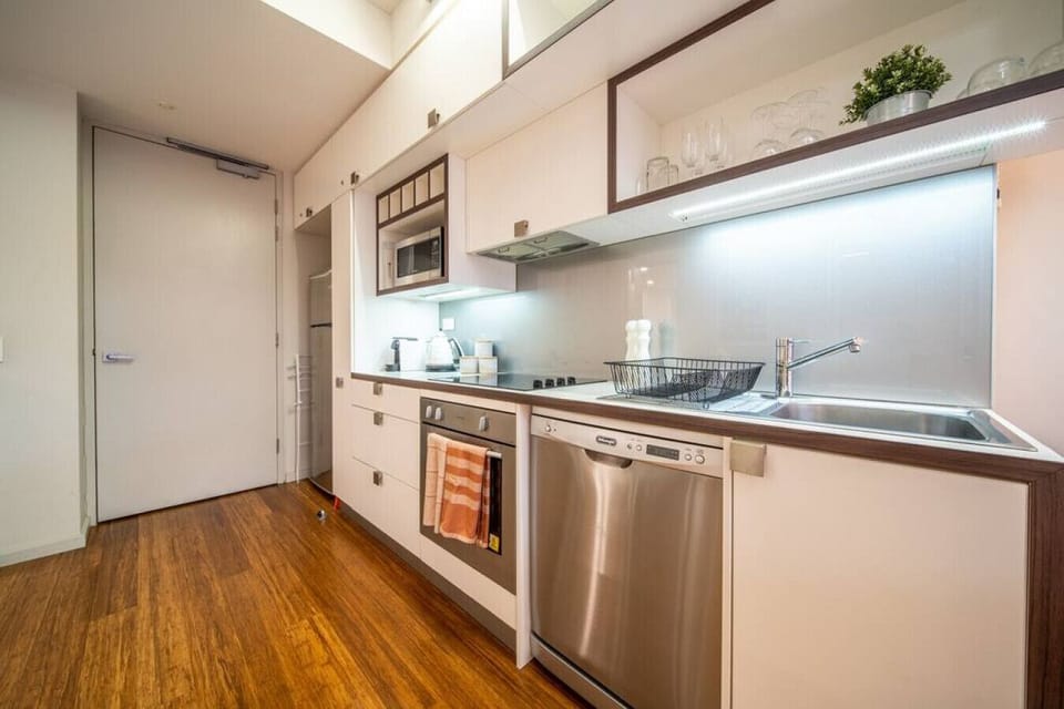Prepare meals with ease in this streamlined kitchen, where everything is within reach for effortless cooking during your stay.