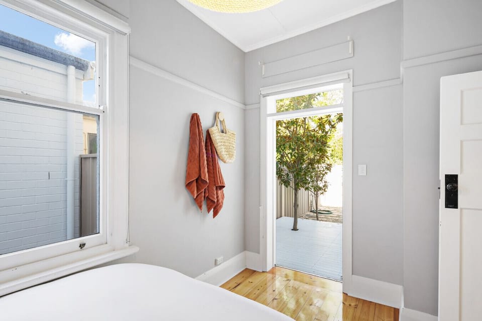 The bedroom offers direct access to the outdoors.